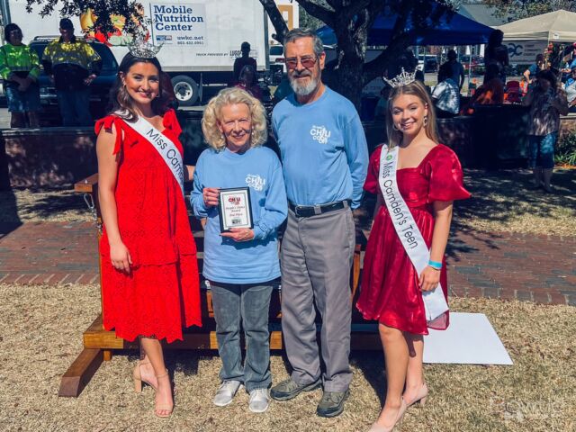 The event was a chili cook-off, where contestants competed to make the best chili. During the event, Miss Camden Teen and the queen were present, perhaps as special guests or participants. Someone took a picture of a man receiving an award, possibly for winning the chili cook-off or for another achievement related to the event.