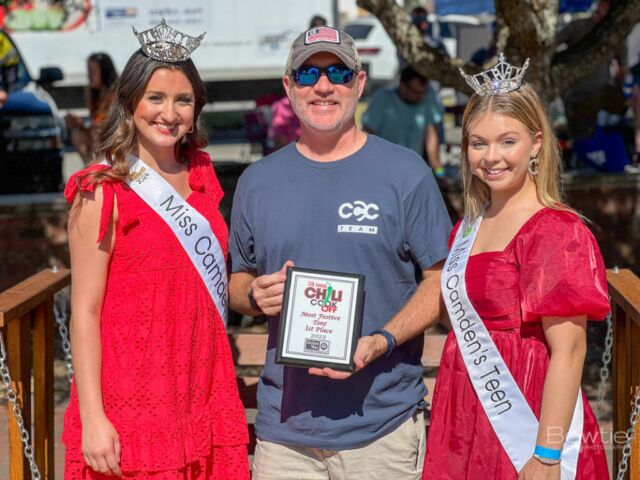 The event was a chili cook-off, where contestants competed to make the best chili. During the event, Miss Camden Teen and the queen were present, perhaps as special guests or participants. Someone took a picture of a man receiving an award, possibly for winning the chili cook-off or for another achievement related to the event.